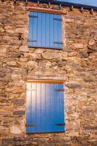 Wooden Shutter on a stone building - Tricoya - Closeup