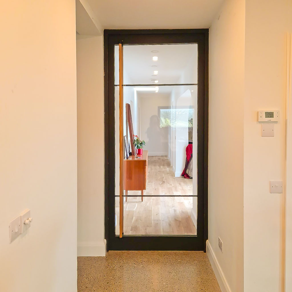 Crittal Style Glass and Timber Door with full length Ash Handles for a modern home